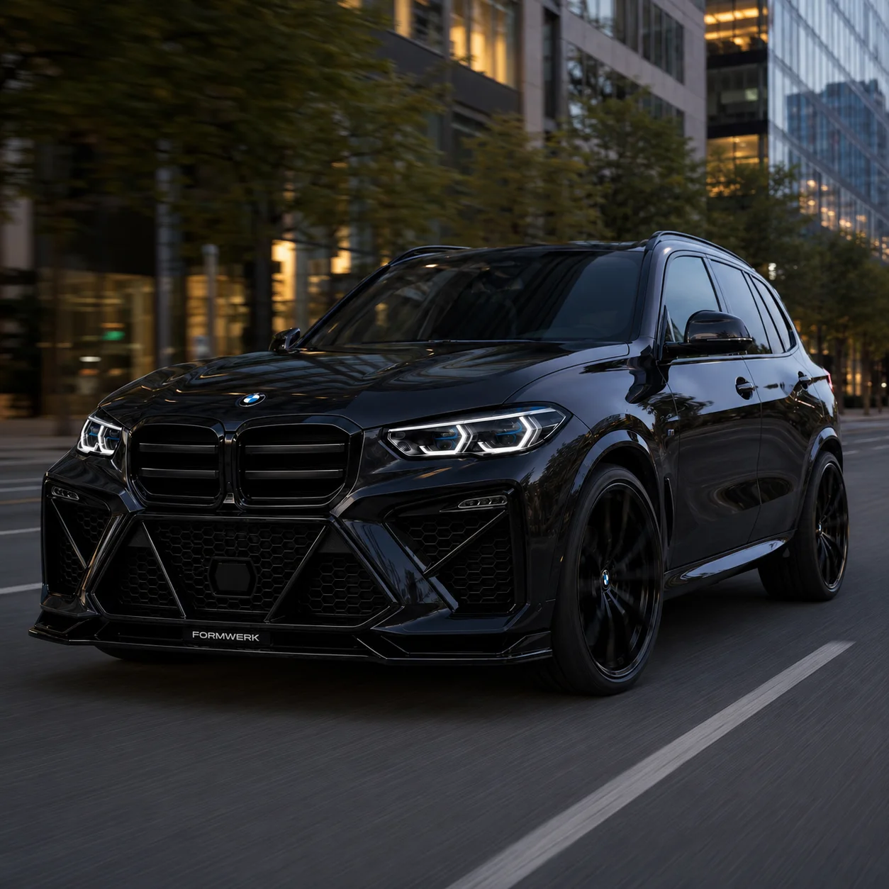 A black X5 with the Bulldog front on a city street at night.